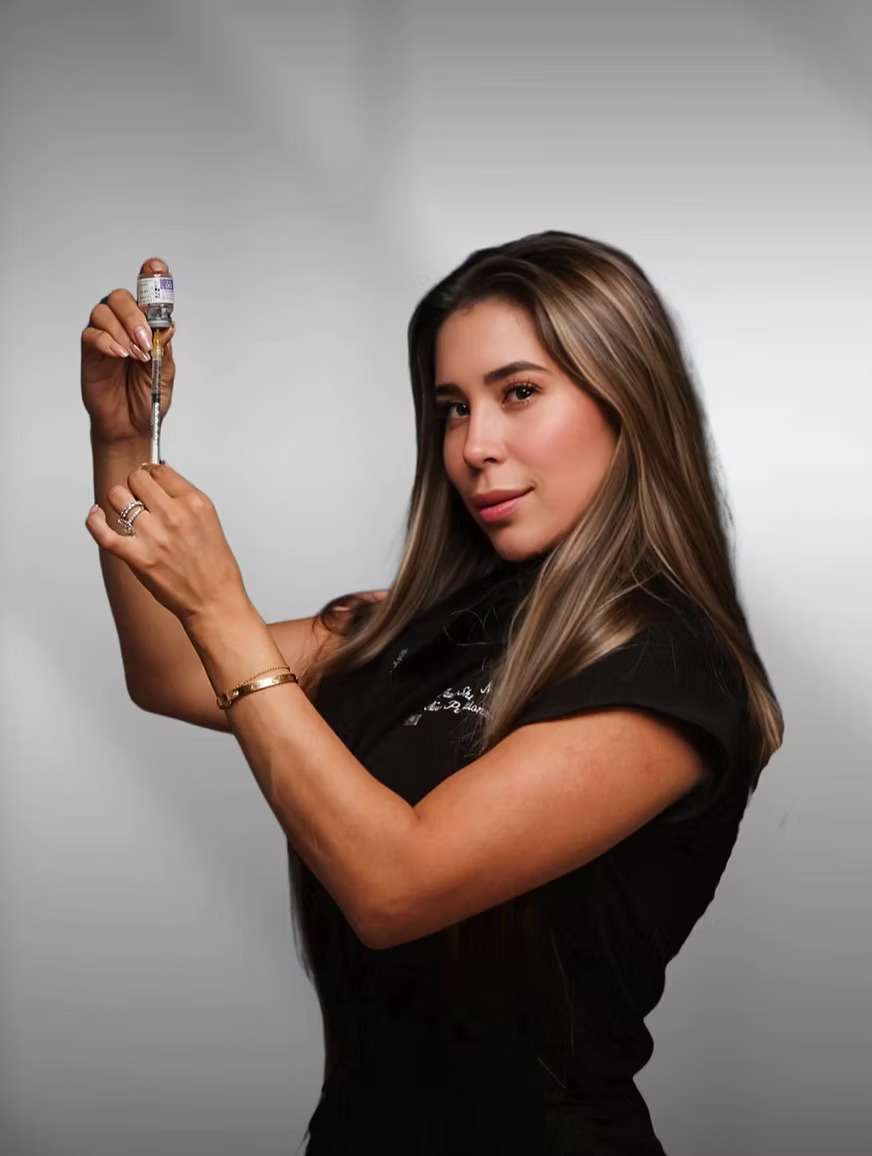Paula Shuster preparing an injectable treatment during a training session
